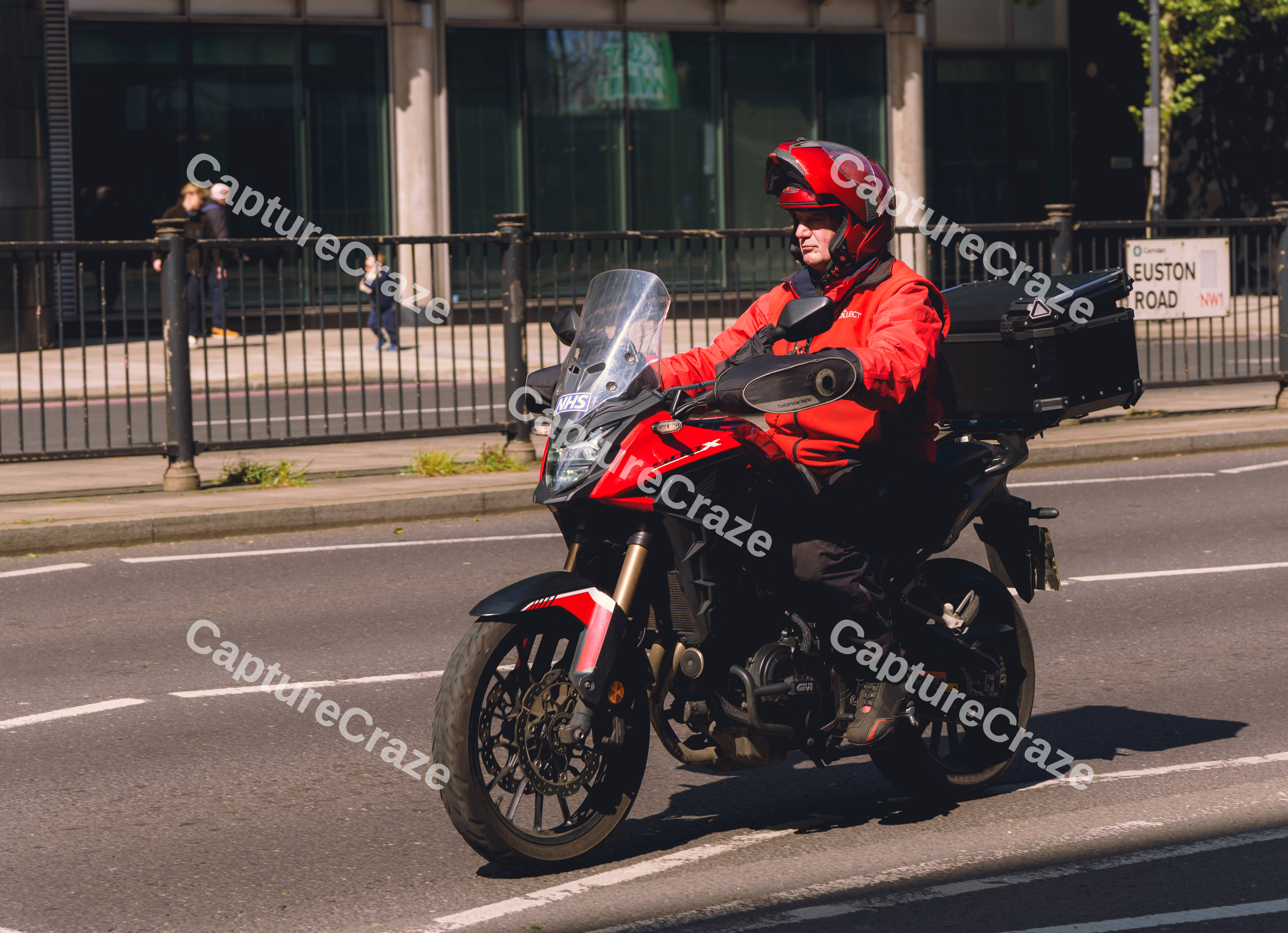Man In Red On Motorcycle